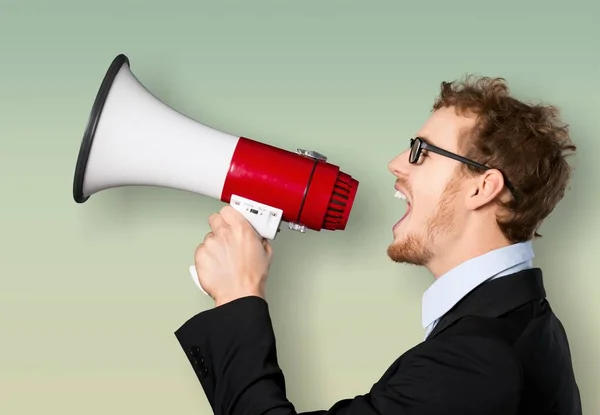 Business man with megaphone — Stock Photo, Image