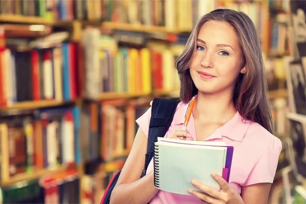 Jonge vrouwelijke student met usa vlag — Stockfoto