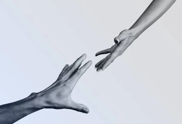 Man and woman reaching to each other
