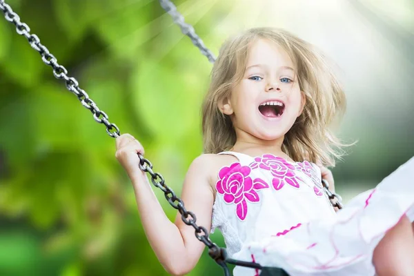 Little girl on swing — Stock Photo, Image