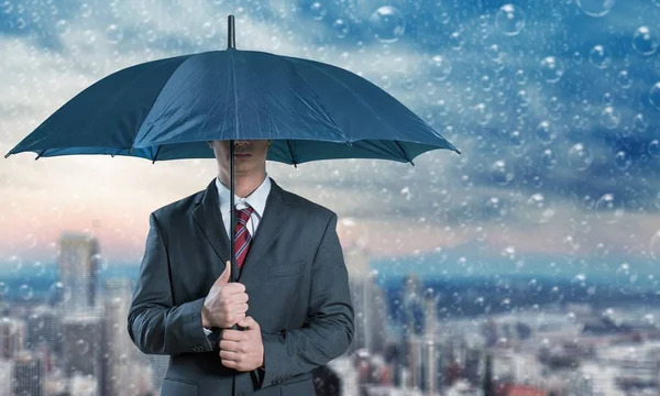 Businessman holding umbrella — Stock Photo, Image