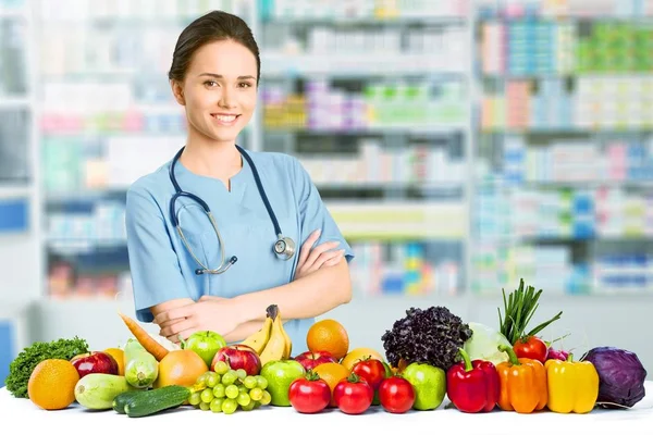 young woman doctor with fresh food