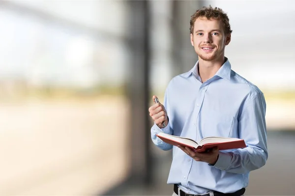 Young Handsome Businessman Curly Hair Holding Open Book Background — Stock Photo, Image