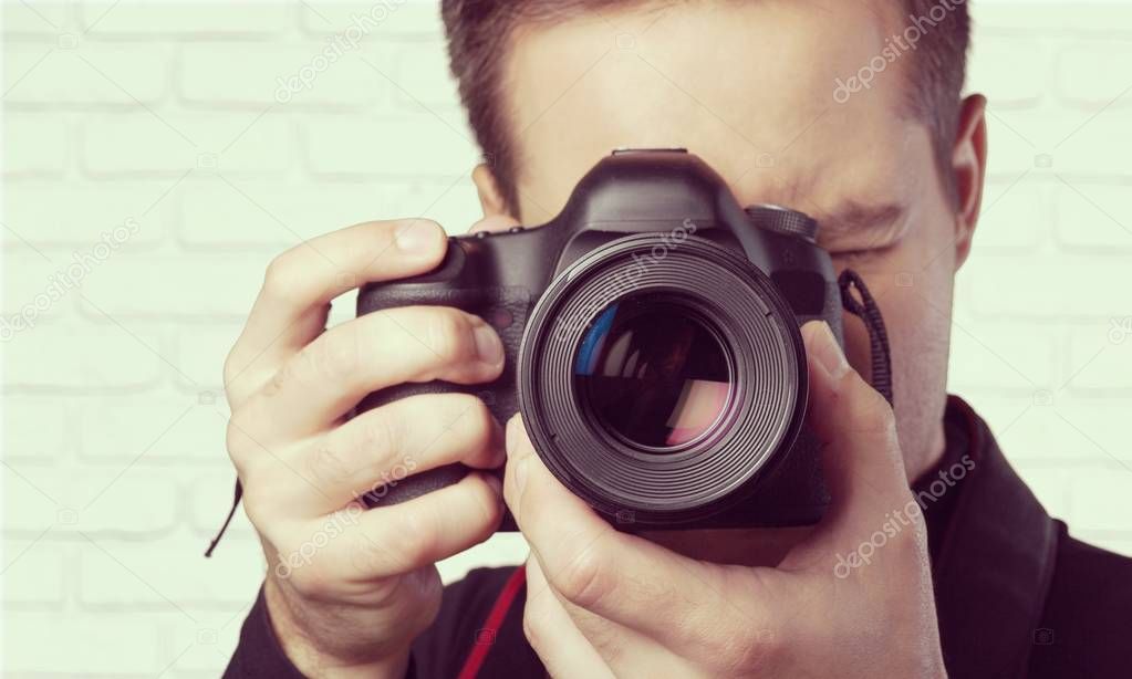 handsome man with camera