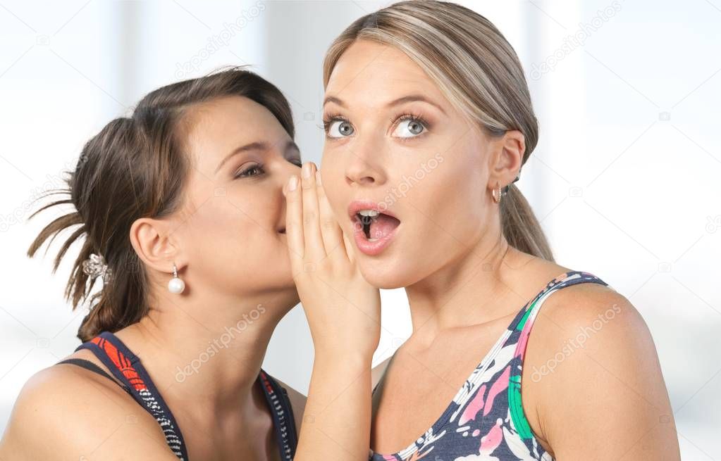 Women gossiping secretly