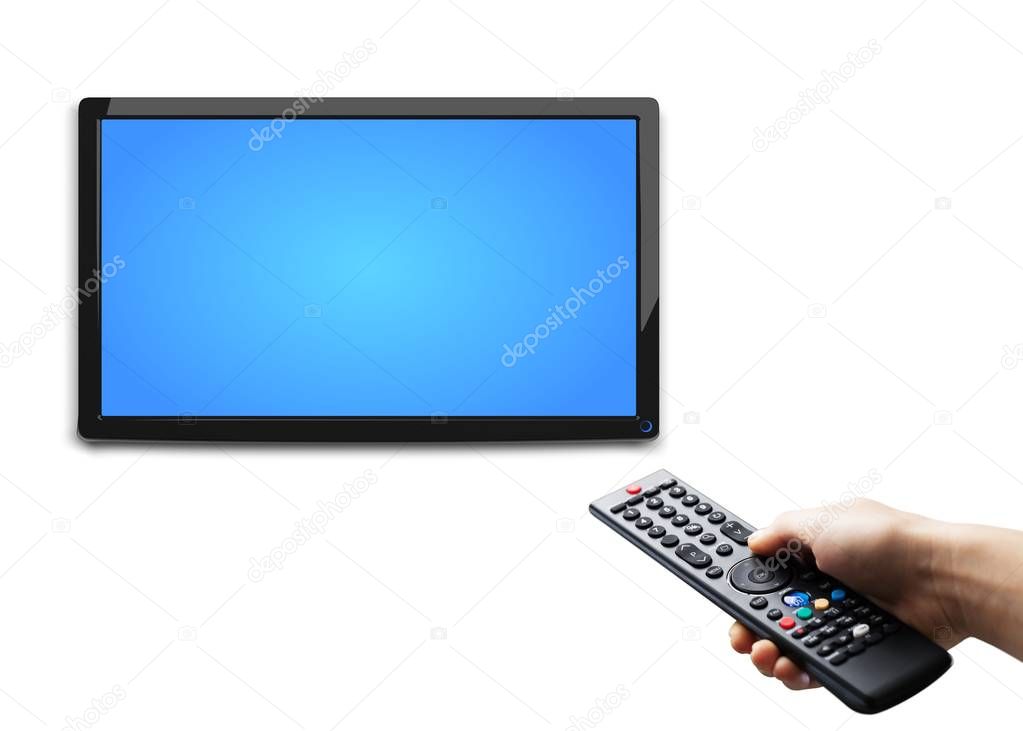 Hand holding tv remote control and surfing programs on television