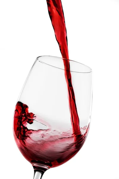 Red wine pouring in glass — Stock Photo, Image