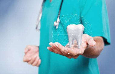 Doktor arka planda diş tutuyor