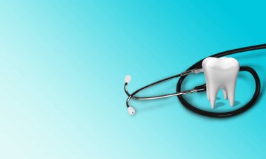 Mavi arka planda diş modeli ve steteskop 