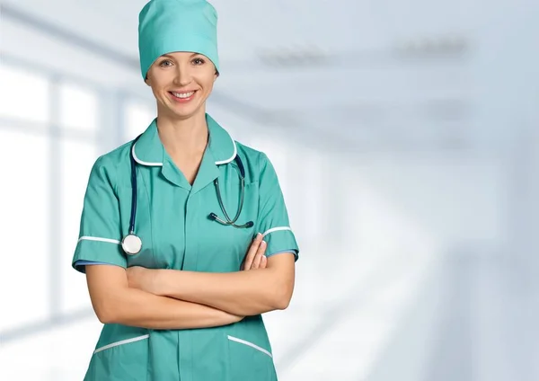 Woman doctor with stethoscope on background