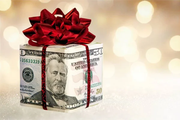 Різдвяний Подарунок Червоним Бантом Загорнутим Доларові Банкноти Фоні — стокове фото