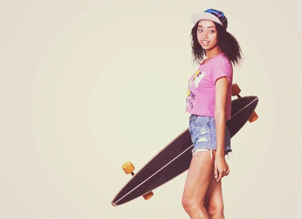 beautiful young woman with skateboard