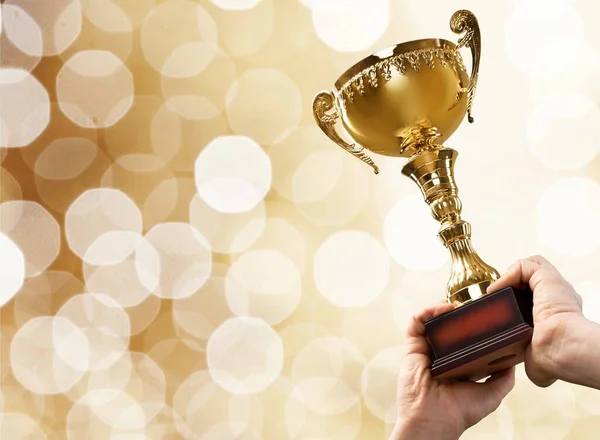 Hands Holding Golden Trophy Background — Stock Photo, Image