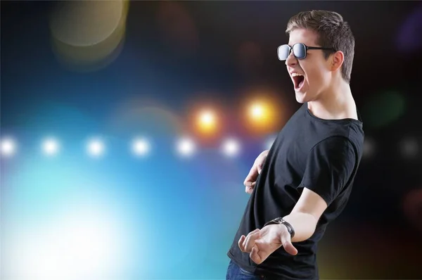 Young Man Playing Air Guitar Stock Image