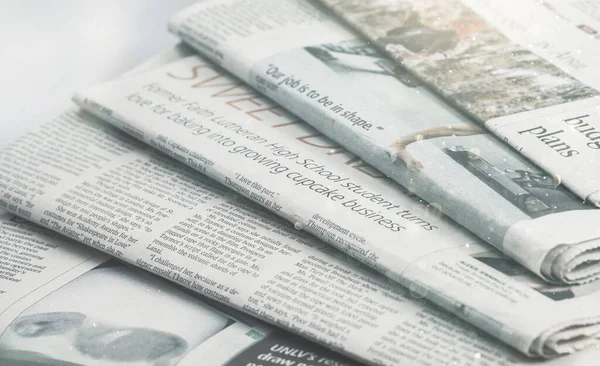 stock image stack of newspapers on background, close up