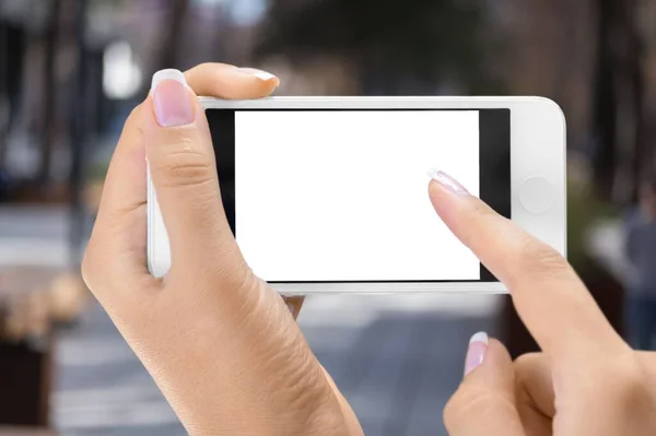 hand holding smartphone with blank screen