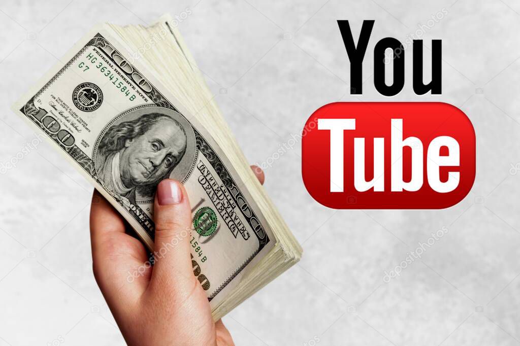 Hand with   money and YouTube logo