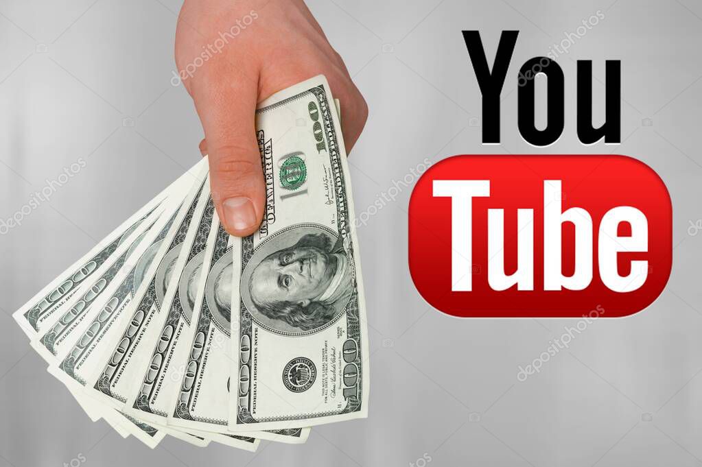 Hand with   money and YouTube logo