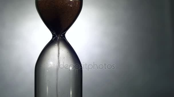 Hourglass on a White Background, the Sand Falls Inside — Stock Video