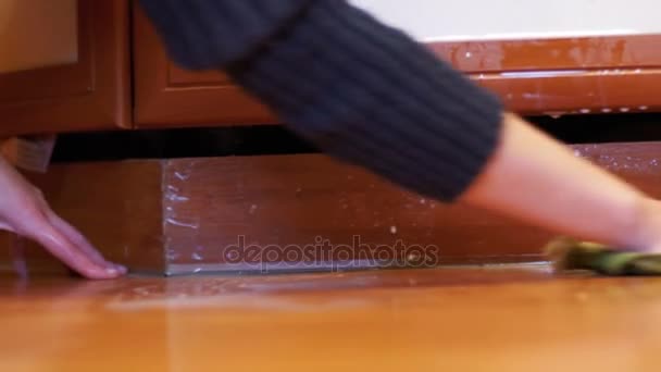 Cleaning the Kitchen Floor with a Cloth from the Spilled Milk, the Liquid in the Home Kitchen — Stock Video