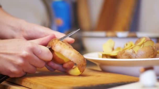 Peeling Potatoes in the Home Kitchen — Stock Video