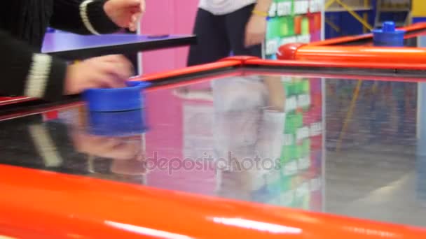 Children Play in the Air Hockey Game in the Childrens Entertainment Center — Stock Video