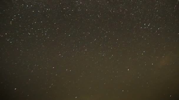 Clouds Moving in the Night Sky against a Background of Stars — Stock Video