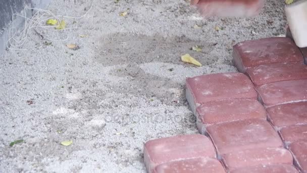 Worker is Laying Paving Stones using Hammer. Slow Motion — Stock Footage Worker is Laying Paving Stones using Hammer. Slow Motion Royalty Free Stock Video