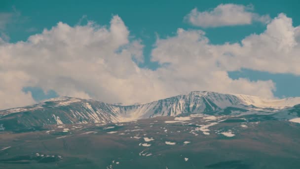 Clouds move over the snowy peaks of the mountains in Armenia — Stock Video