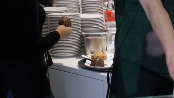 Fast food Cafe at work. Waiters behind the counter, work process, street fast food cafe — Stock Video