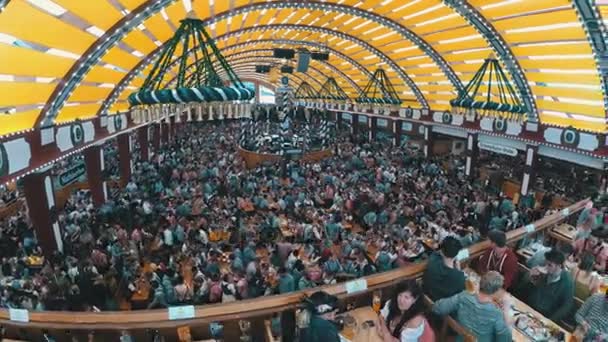 People Celebration of Oktoberfest in large beer tent. Bavaria, Germany — Stock Video