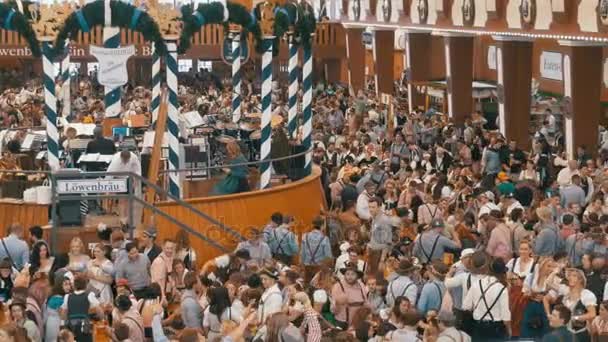 People Celebration of Oktoberfest in large beer tent. Bavaria, Germany — Stock Video