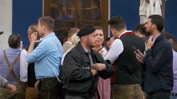 People in national Bavarian suits on the street of Oktoberfest festival. Bavaria, Slow Motion — Stock Video