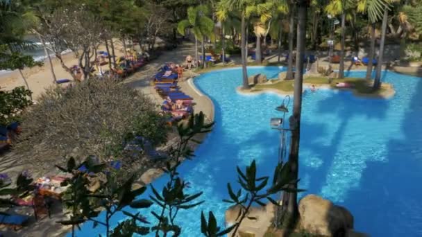 Tropical Hotel with swimming pool blue water on the beach — Stock Video