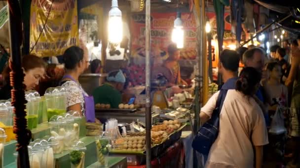 People walk at National Asian street food in Night Market on Jomtien Beach — Stock Video