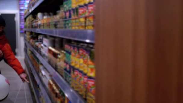 Rows and Shelves with Various Products in the Supermarket. Buyers Choose the Product. — Stock Video