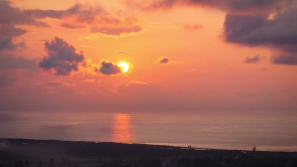 Timelapse of Sunset in the Clouds over the Sea and the City, légi felvétel. — Stock videók