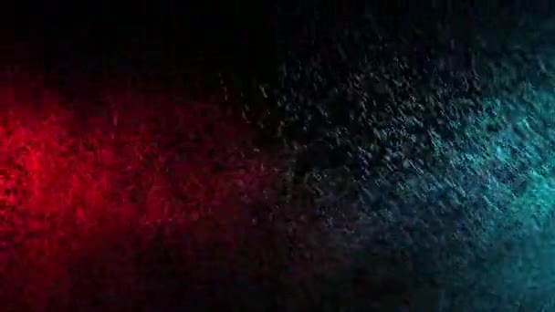 黒の背景に緑と赤の水噴霧混合。スローモーション — ストック動画