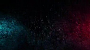 Yeşil ve Kırmızı Su Spreyi Siyah Arkaplanda Karıştırılmış. Yavaş Hareket