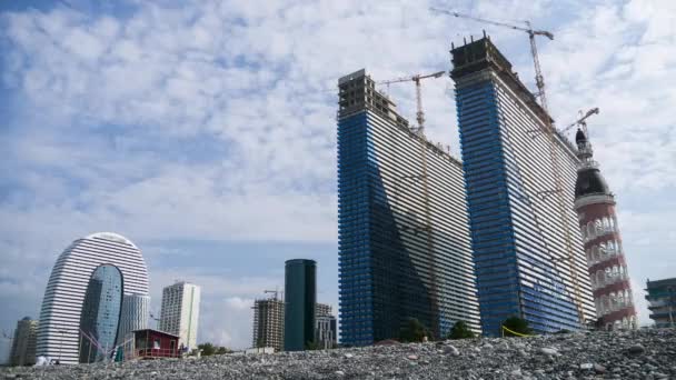 Construction of a Modern Skyscrapers using Tower Cranes. Timelapse. Moving Clouds on Blue Sky — 图库视频影像