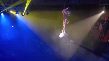 Aerial Acrobatic Duet is Performing on Silk in a Circus Stage.