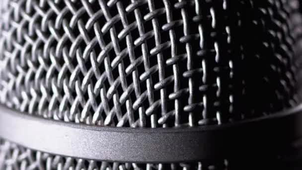 The Microphone Rotates on a Black Background. Dynamic Microphone Grid Spins Close-up — 비디오