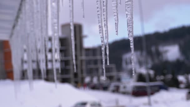 Icicles Melt and Dripping on the Roof of House. Slow Motion — Wideo stockowe