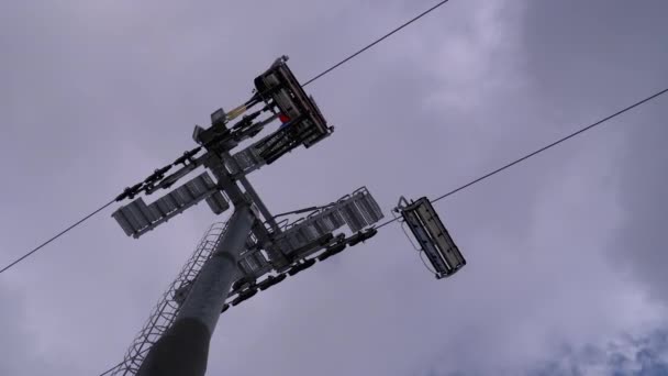 Ski Lift with Skiers on a Background of Blue Sky and Clouds. Ski Resort. — Αρχείο Βίντεο