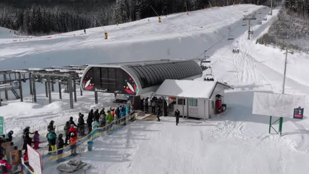 Aerial Lot of Skiers Stand in Line for Lift on Ski Resort. Skiing on Ski Slopes. — Stock videók