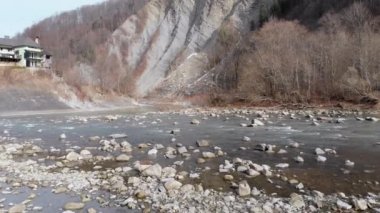 Flying over Wild Mountain River Flowing with Stone Boulders and Rapids