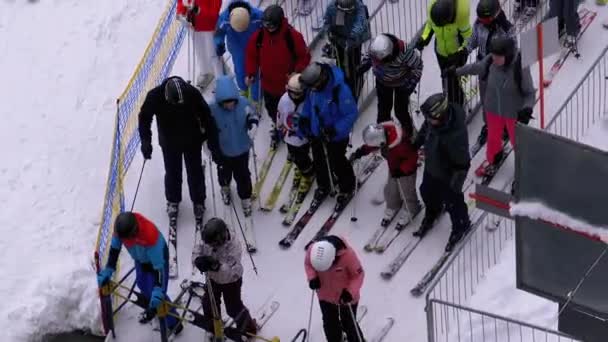 The Queue on the Ski Lift. Crowd of Skiers Stands and Crowds at Turnstile Gates — Stock Video