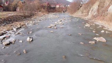 Flying over Wild Mountain River Flowing with Stone Boulders and Rapids