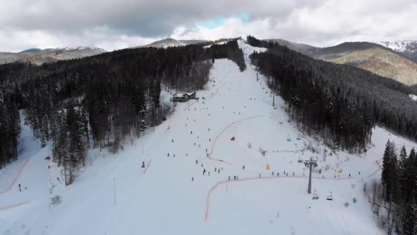 Aerial view on Ski Slopes with Skiers and Ski Lifts on Ski Resort in Winter — Stock Video