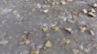 Flying over Wild Mountain River Flowing with Stone Boulders and Rapids